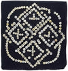 Antique textile artwork with mother of pearl buttons