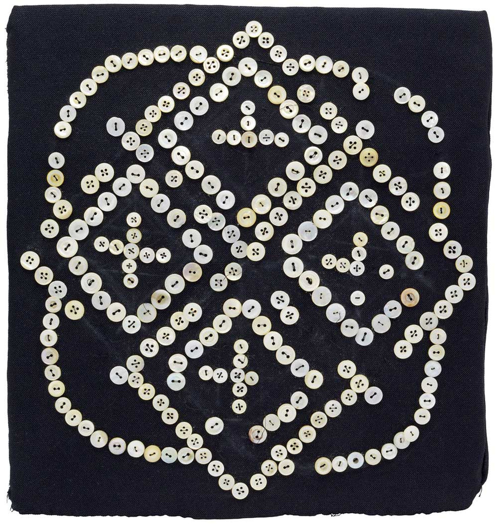 Antique textile artwork with mother of pearl buttons
