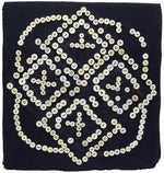 Antique textile artwork with mother of pearl buttons