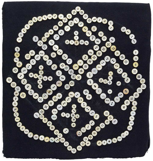 Antique textile artwork with mother of pearl buttons